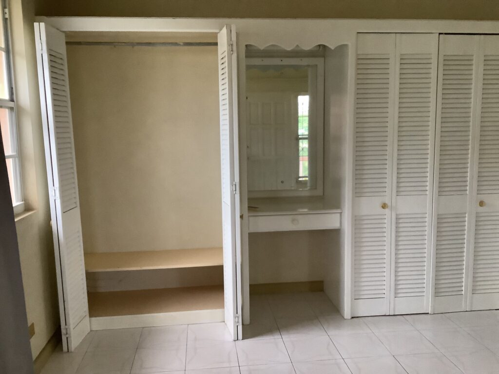 A picture of a wardrobe in one of the apartments.